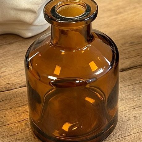 Amber Glass Bottle vessel in warm honey-coloured glass